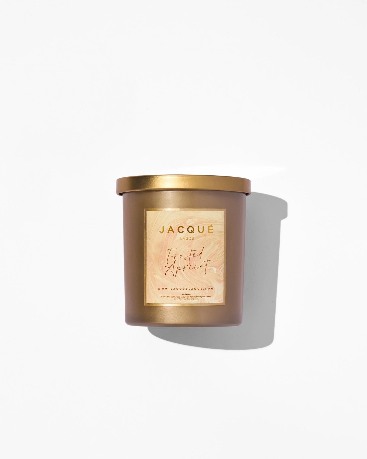 frosted apricot candle in gold container